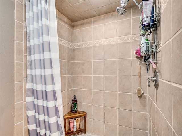 full bathroom with tiled shower