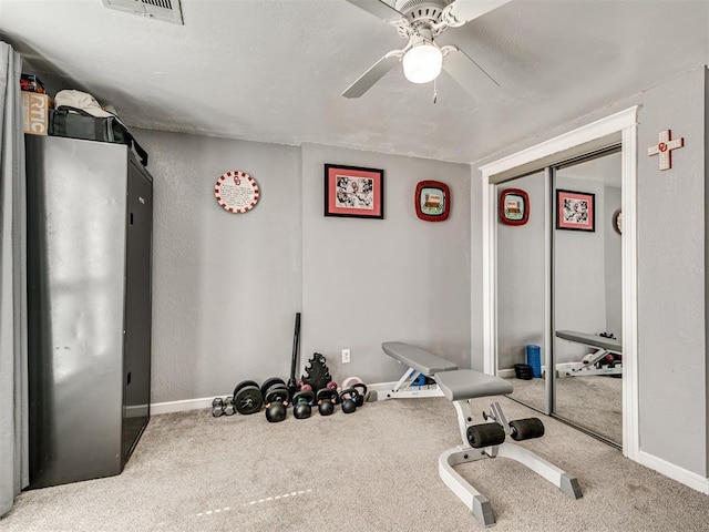 workout area featuring carpet floors, baseboards, and visible vents