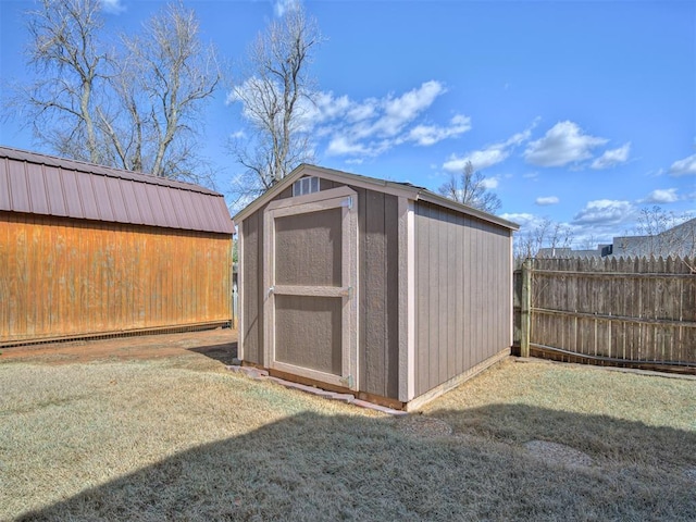 view of shed with fence