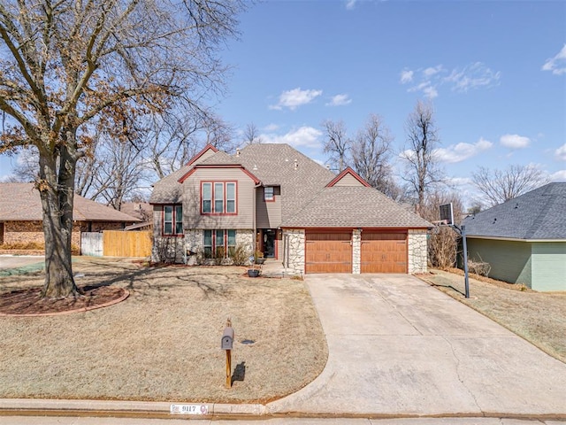 view of front facade with a garage, a shingled roof, fence, stone siding, and concrete driveway