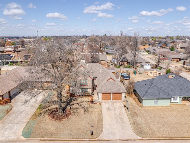 birds eye view of property with a residential view