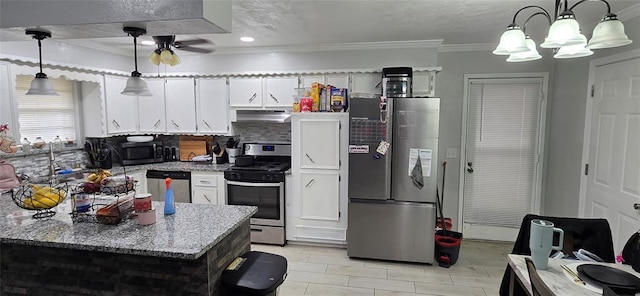 kitchen featuring decorative backsplash, white cabinets, under cabinet range hood, appliances with stainless steel finishes, and crown molding