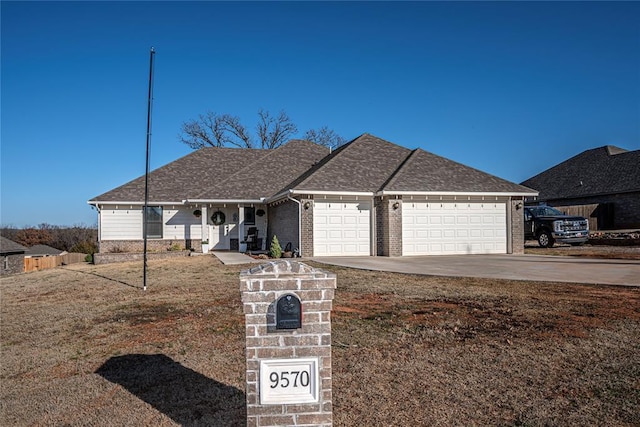 ranch-style home featuring a garage, concrete driveway, brick siding, and roof with shingles