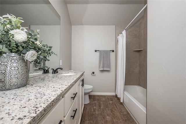 full bathroom featuring toilet, wood finished floors, vanity, baseboards, and shower / tub combo with curtain