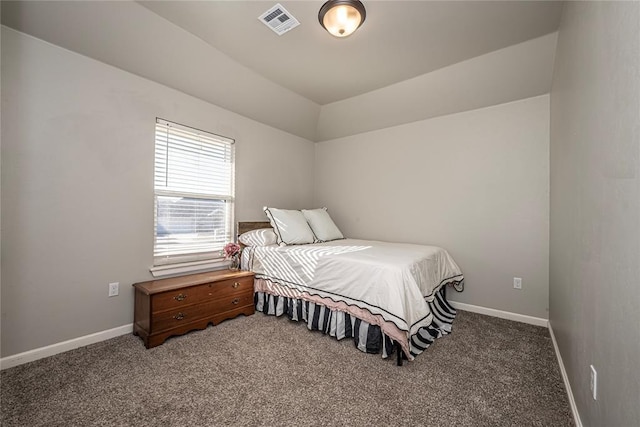 carpeted bedroom featuring visible vents and baseboards