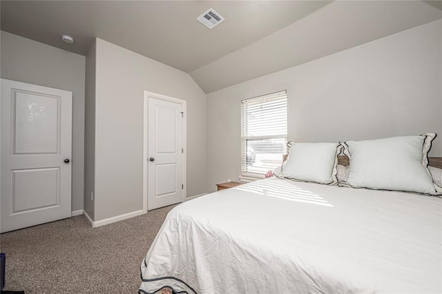 bedroom featuring carpet floors, visible vents, vaulted ceiling, and baseboards