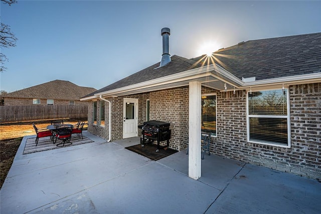 view of patio / terrace with area for grilling and fence