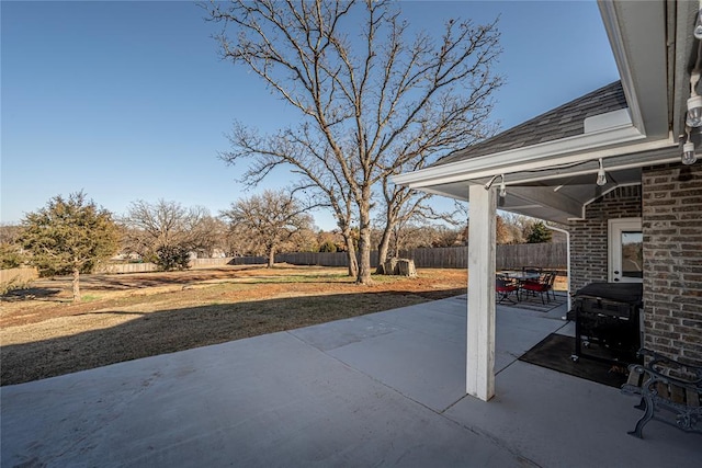 view of patio featuring fence