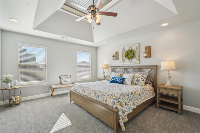 bedroom with visible vents, baseboards, a raised ceiling, and carpet flooring