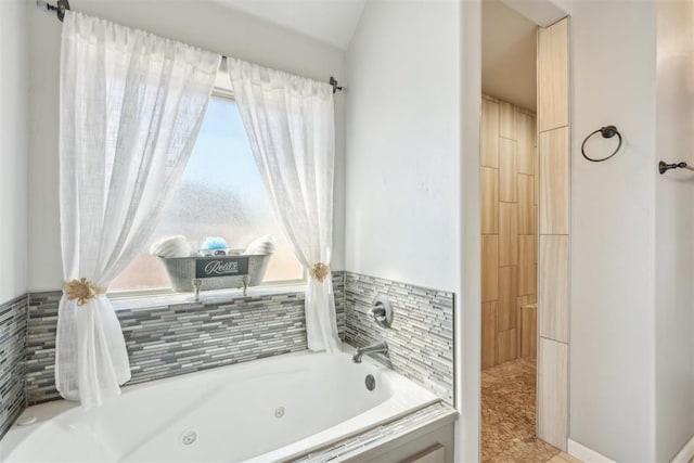 full bathroom featuring a jetted tub