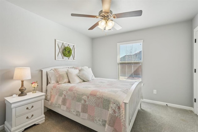 carpeted bedroom with visible vents, baseboards, and a ceiling fan