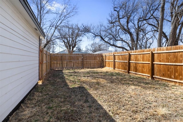 view of yard with a fenced backyard