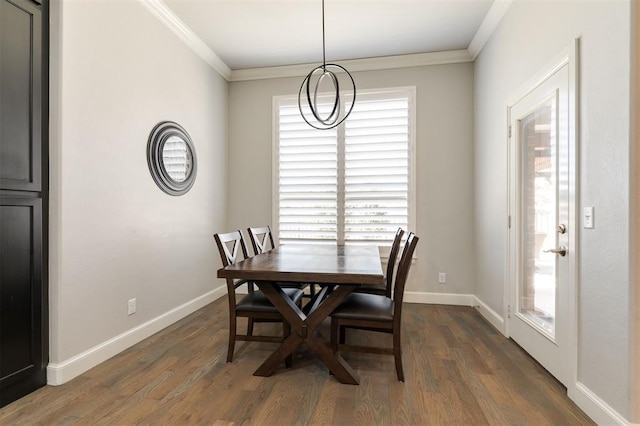 dining area with baseboards, dark wood-style flooring, and crown molding