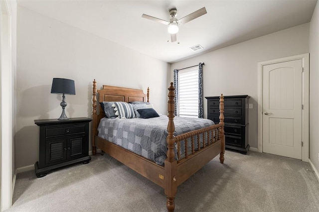 bedroom with light carpet, baseboards, visible vents, and a ceiling fan