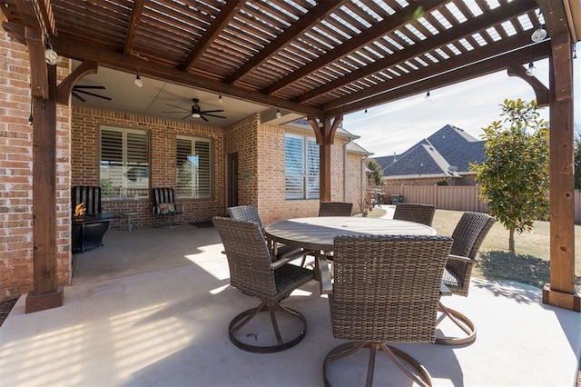 view of patio / terrace featuring a ceiling fan, outdoor dining space, fence, and a pergola