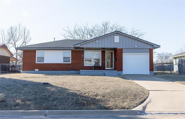 single story home featuring a garage, concrete driveway, brick siding, and fence