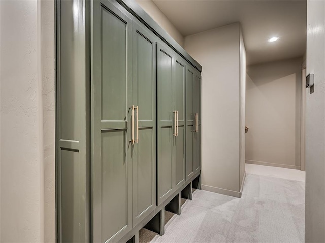 mudroom featuring light carpet, recessed lighting, and baseboards