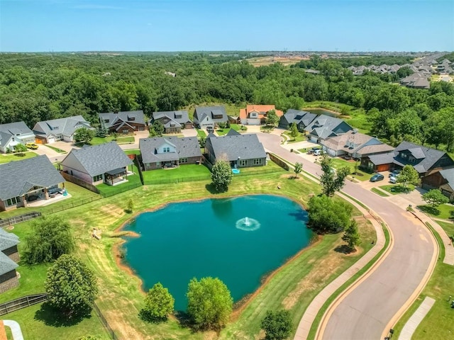 birds eye view of property with a residential view, a water view, and a forest view