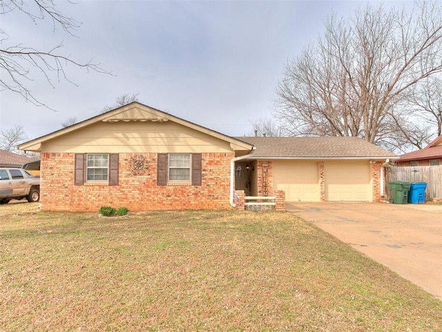 ranch-style house with concrete driveway, brick siding, and a front yard