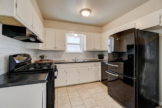 kitchen with under cabinet range hood, white cabinetry, backsplash, black appliances, and dark countertops