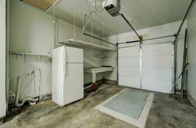 garage with a garage door opener and freestanding refrigerator