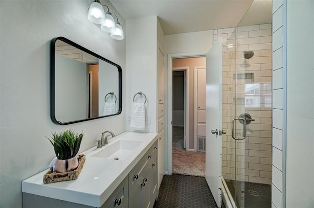 bathroom featuring visible vents, a shower stall, vanity, and tile patterned floors