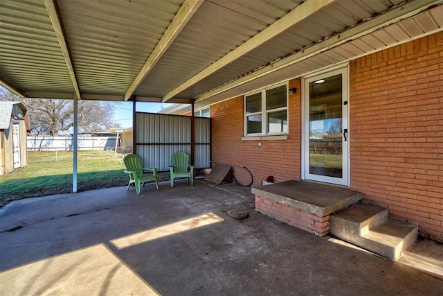 view of patio featuring fence