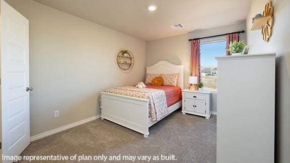 carpeted bedroom featuring visible vents and baseboards