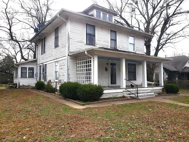 traditional style home featuring covered porch