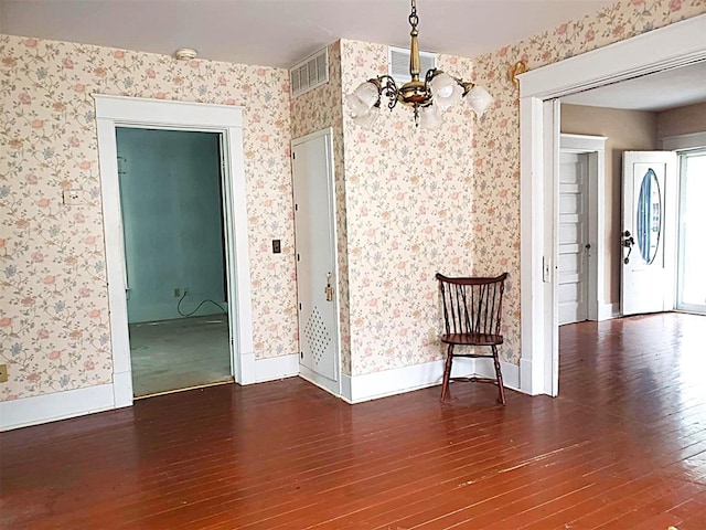 interior space featuring visible vents and wallpapered walls