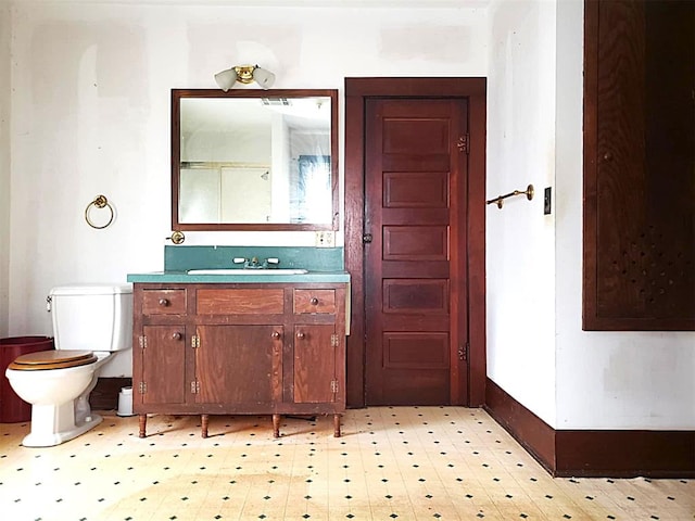 bathroom with visible vents, vanity, toilet, and tile patterned floors