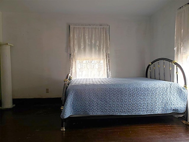 bedroom with wood finished floors