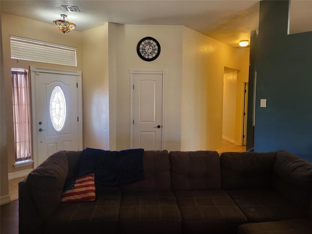 living room featuring visible vents