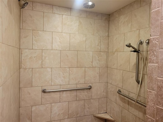 full bathroom with tiled shower