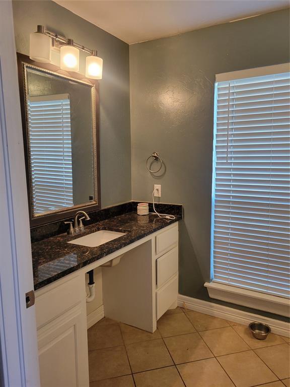 bathroom featuring a sink and tile patterned floors