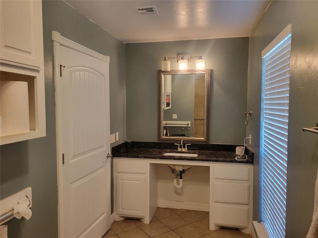 bathroom featuring vanity, visible vents, and tile patterned floors