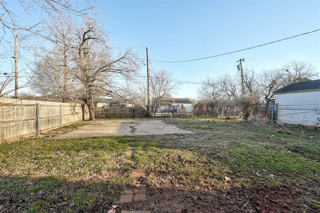 view of yard with a patio area and a fenced backyard