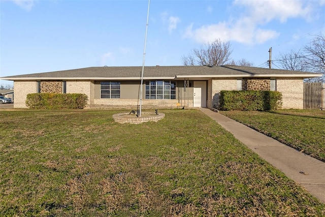 single story home featuring a front lawn and brick siding