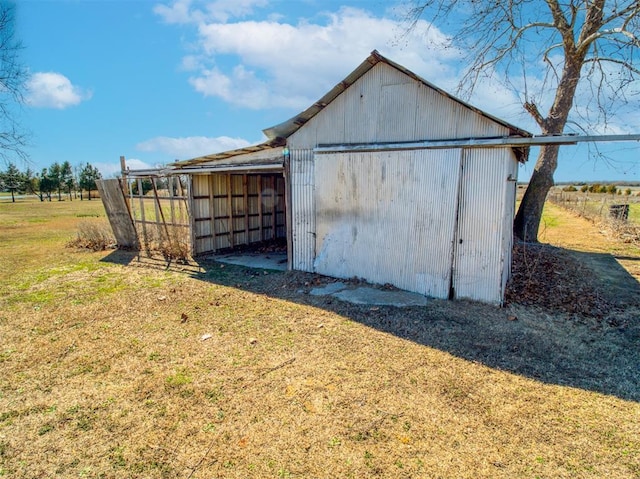 view of pole building with a yard