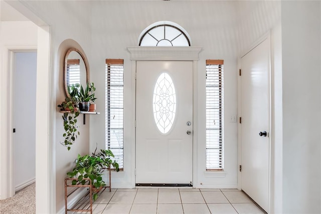 foyer with light tile patterned floors and plenty of natural light