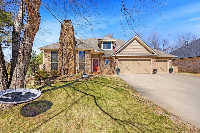 view of front facade with brick siding, concrete driveway, a front yard, and a garage