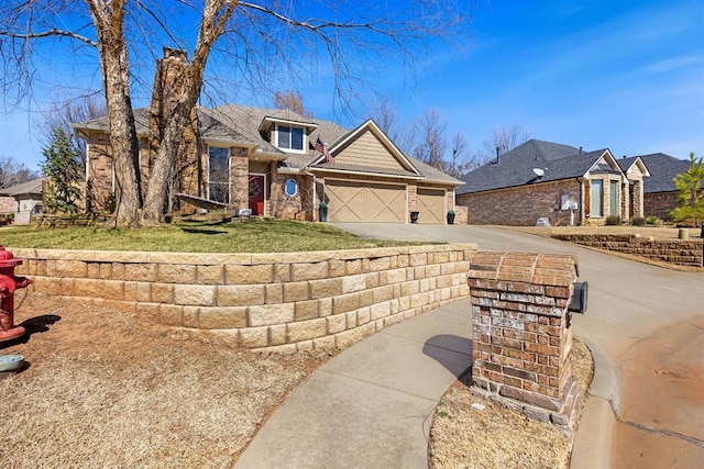 view of front of house with concrete driveway and an attached garage