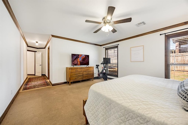 bedroom with a ceiling fan, baseboards, visible vents, carpet floors, and crown molding