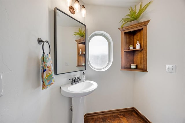 bathroom featuring baseboards