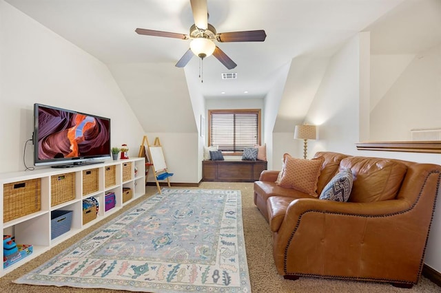 carpeted living area featuring lofted ceiling, visible vents, and ceiling fan