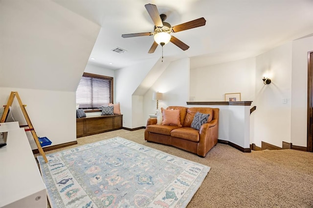 living area with visible vents, carpet flooring, baseboards, and ceiling fan