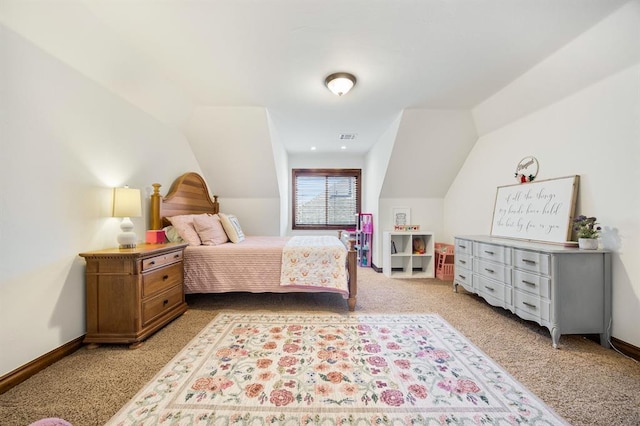 bedroom featuring lofted ceiling, baseboards, and visible vents