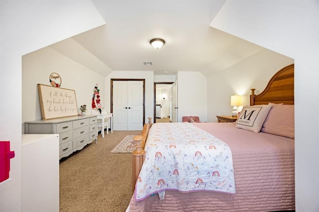 bedroom featuring a closet, visible vents, light colored carpet, and vaulted ceiling