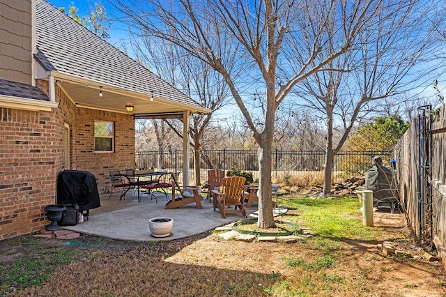 view of yard with a fenced backyard and a patio area