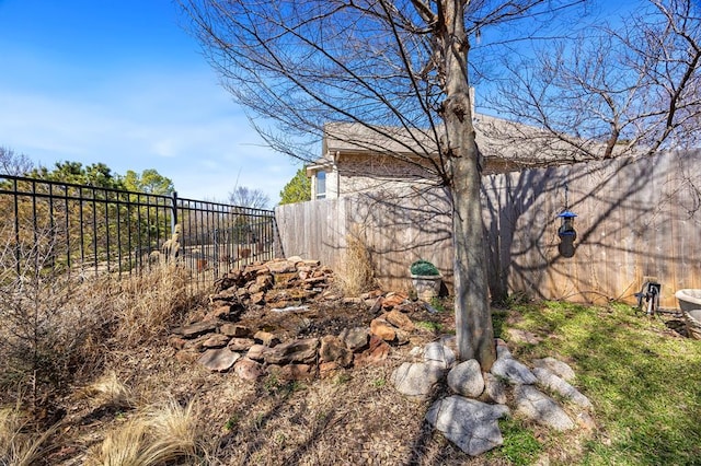 view of yard with a fenced backyard